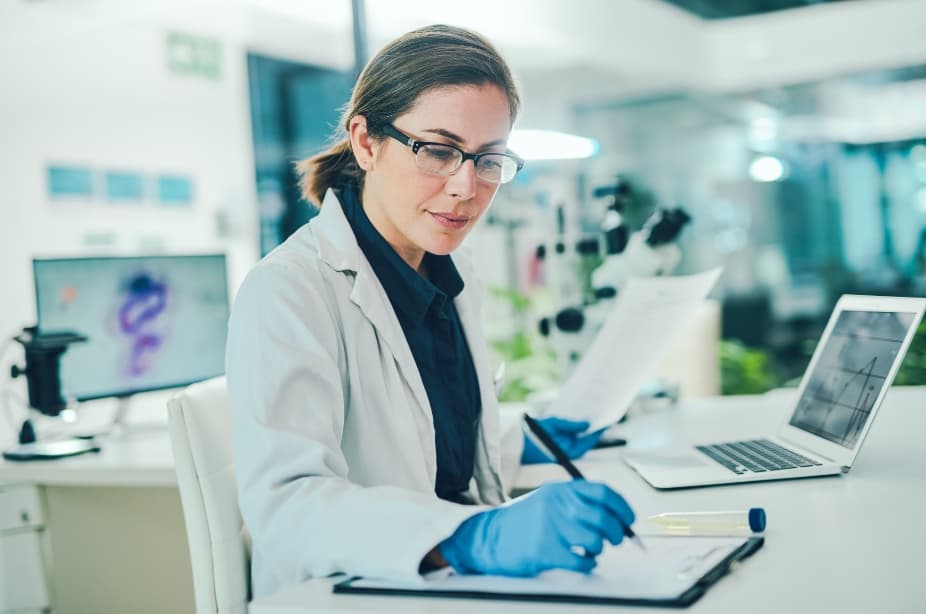 Scientist reviewing trial documentation