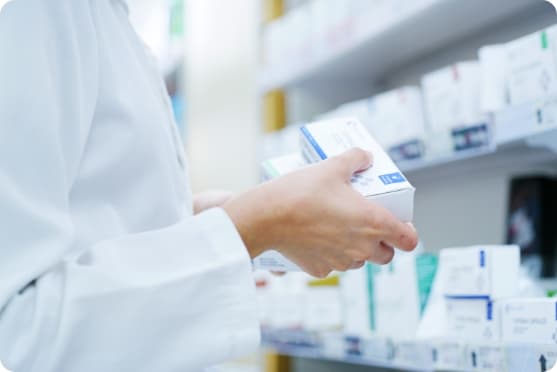 Pharmacist preparing boxed medication