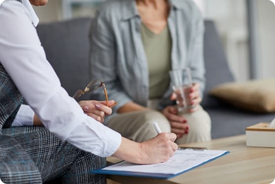 Counsellor taking notes during a patient visit